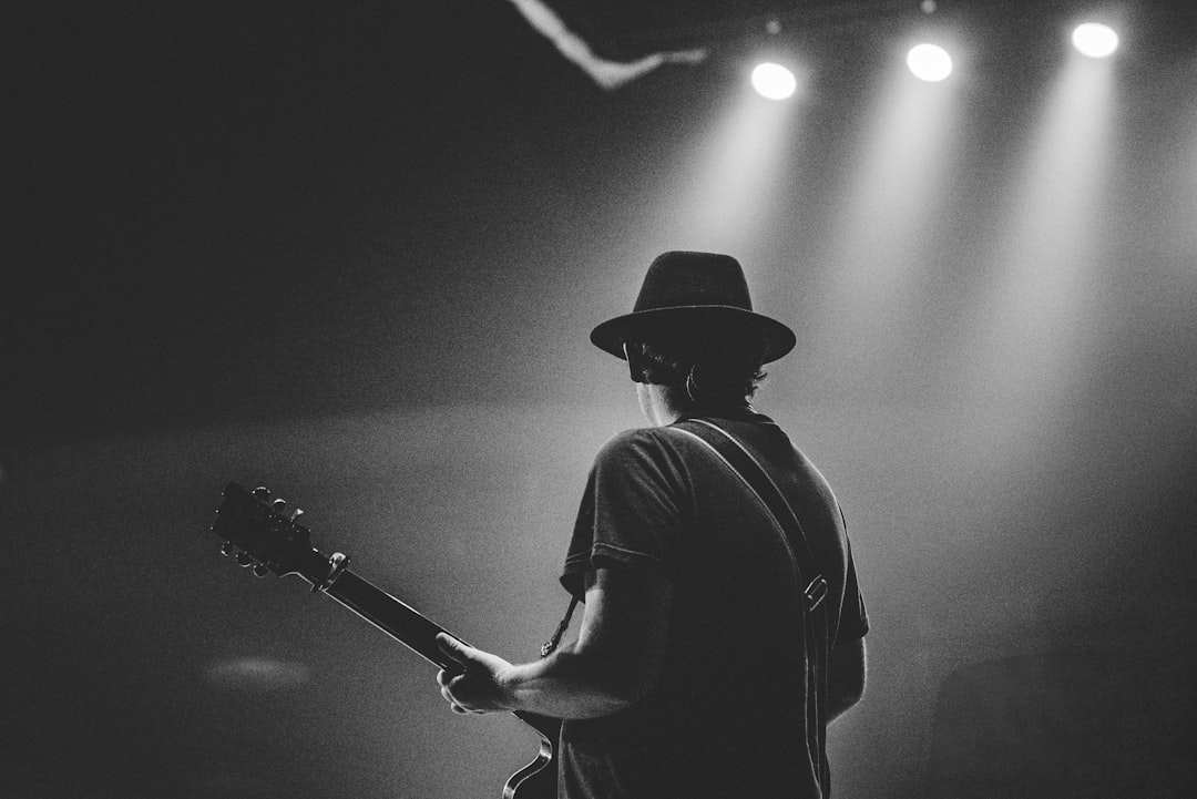 Musician performing live during an intimate music experience