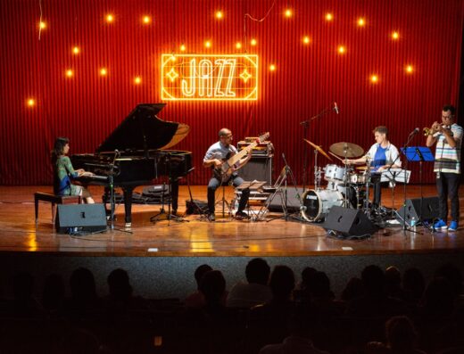 Musicians performing live on stage during an evening concert