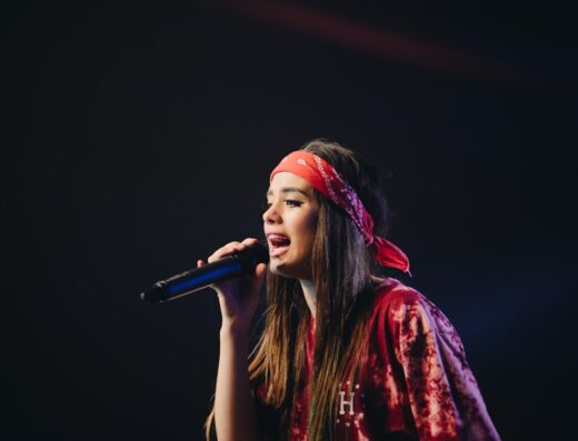 Singer performing with musicians in an intimate live music venue